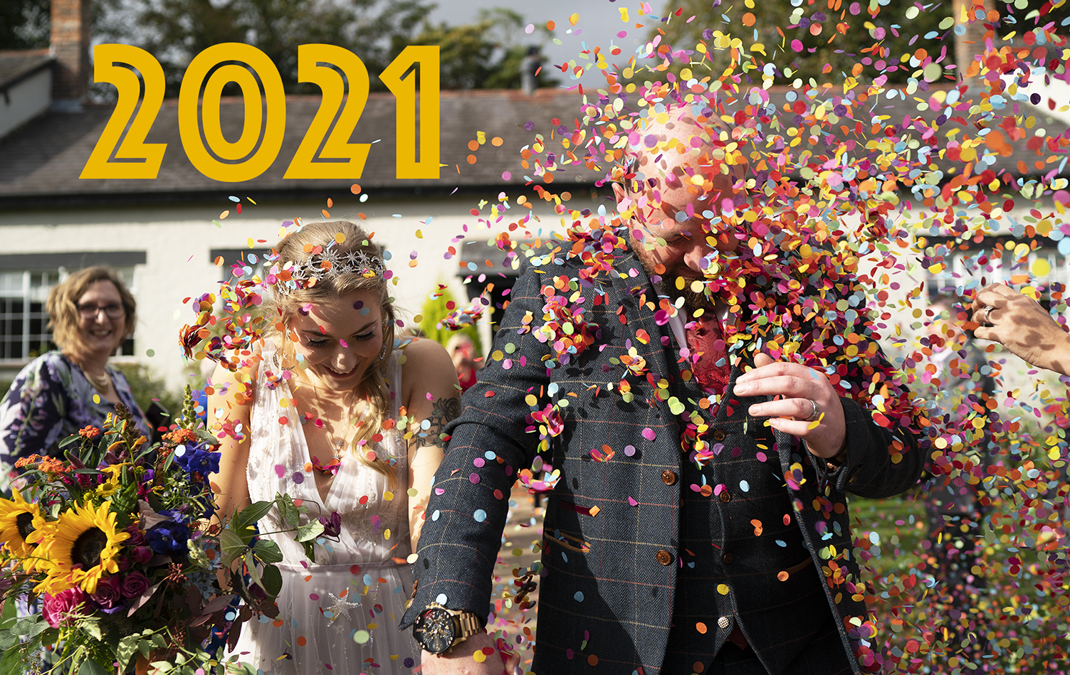 2021 couple in love hit with confetti