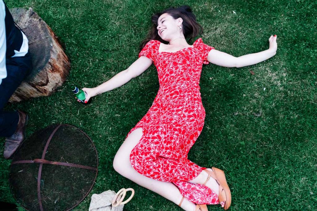 girl laying on grass
