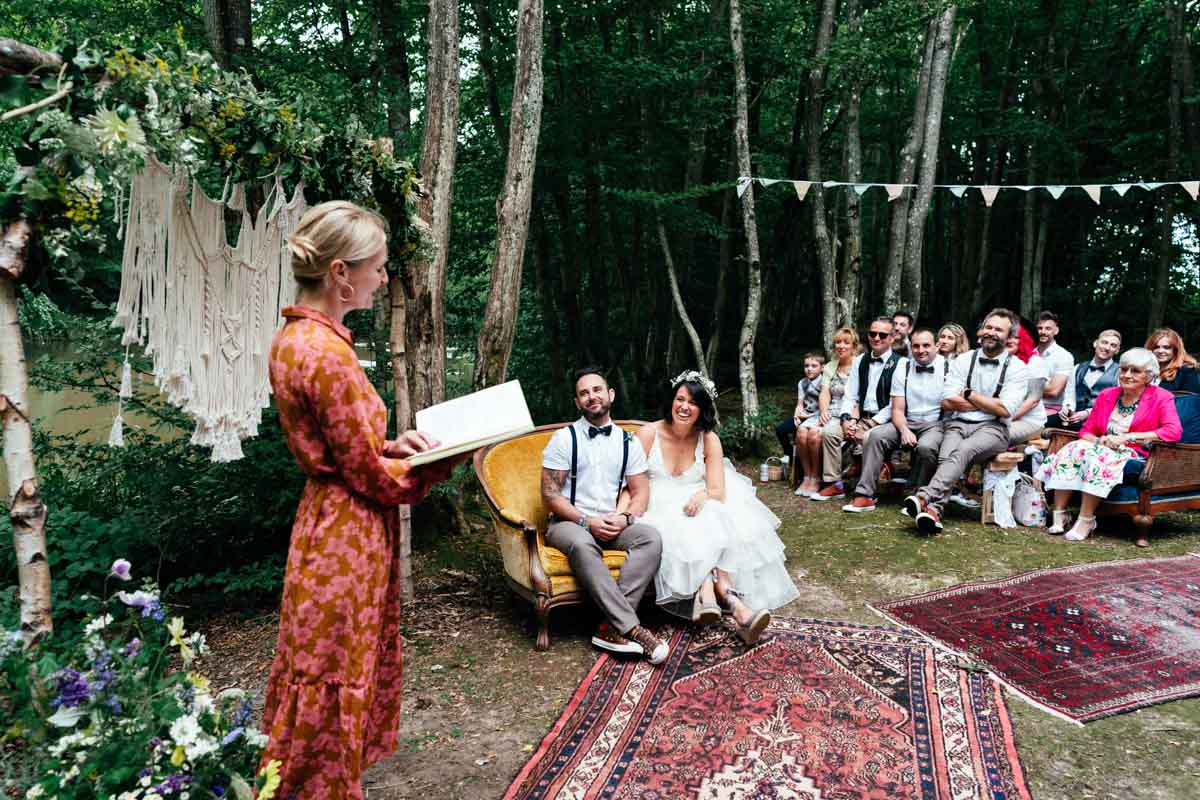 couple in woods on yellow sofa getting married
